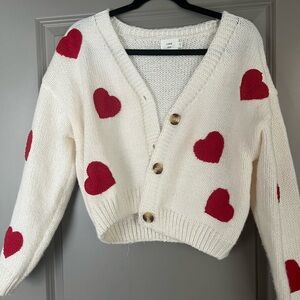 White with red hearts sweater.